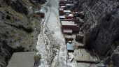 Drone picture shows flooded buildings in the aftermath of landslides caused by intense rains and illegal earth movements, in the Inca Llojeta area