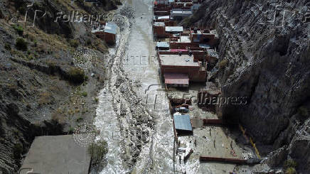 Drone picture shows flooded buildings in the aftermath of landslides caused by intense rains and illegal earth movements, in the Inca Llojeta area