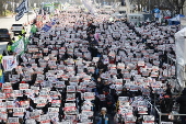 Supporters of South Korean President Yoon hold rally ahead of impeachment vote