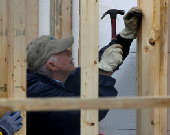 FILE PHOTO: Former U.S. President Jimmy Carter attends Habitat for Humanity home building site in Washington