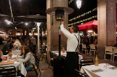 Tourists enjoy last days of gas heaters on Barcelona's terraces