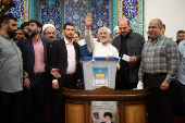 Presidential candidate Saeed Jalili votes at a polling station in a snap presidential election, in Tehran