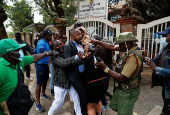 Kenyan activists and civil society representatives gather to deliver a list of people who disappeared during demonstrations against the government proposed tax hikes, in Nairobi