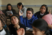 Students attend a class at a school in Qamishli