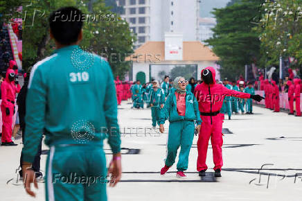 Players take part in the Red Light, Green Light game at Gelora Bung Karno Stadium ahead of the release of the Netflix series Squid Game: Season 2 in Jakarta