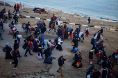 Displaced Palestinians wait to be allowed to return to their homes in northern Gaza, in the central Gaza Strip