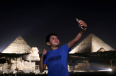 Giza Pyramids are lit up for World Tourism Day on the outskirts of Cairo