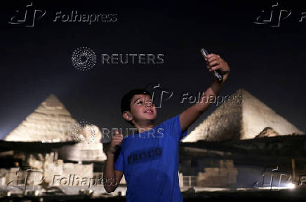 Giza Pyramids are lit up for World Tourism Day on the outskirts of Cairo