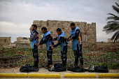 Syrian Civil Defense team clears unexploded ordnance in Idlib countryside