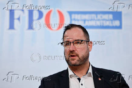 Far-right Freedom Party's co-Secretary-General Christian Hafenecker speaks to reporters