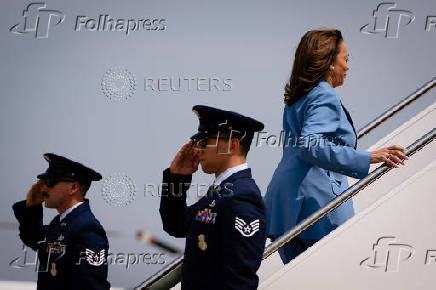 U.S. Democratic presidential nominee Kamala Harris walks to board Air Force Two at Joint Base Andrews in Maryland