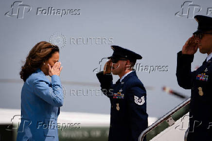 U.S. Democratic presidential nominee Kamala Harris walks to board Air Force Two at Joint Base Andrews in Maryland