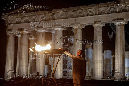 Olympic flame for Paris 2024 arrives at the Acropolis, in Athens