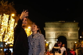 Paris Olympics chief Estanguet turns on Christmas lights on the Champs Elysees