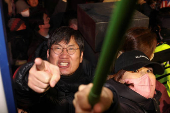 Pro-Yoon protesters participate in a rally outside a court, in Seoul