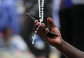 Members of the Roman Catholics commemorate Good Friday during the start of Easter in Harare