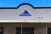 FILE PHOTO: The logo of Australia's biggest independent coal miner Whitehaven Coal Ltd is displayed on their office building located in the north-western New South Wales town of Gunnedah in Australia