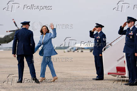 U.S. Democratic presidential nominee Kamala Harris descends from Air Force Two at the Joint Base Andrews in Maryland