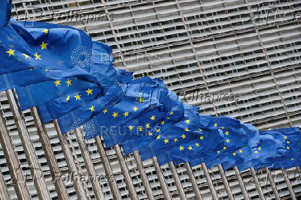 FILE PHOTO: Flags flutter outside EU Commission in Brussels