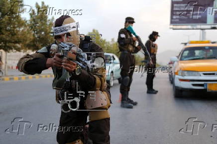 Afghans Taliban conduct checks on people and vehicles at checkpoints in Kabul