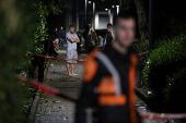 Israeli emergency services work at the scene of a missile strike, in Jaffa, south of Tel Aviv