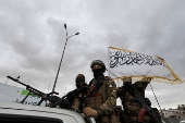 FILE PHOTO: Khaled Brigade, a part of Hay'at Tahrir al-Sham (HTS), hold a military parade, in Damascus