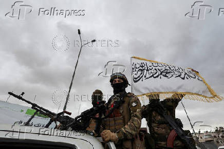 FILE PHOTO: Khaled Brigade, a part of Hay'at Tahrir al-Sham (HTS), hold a military parade, in Damascus