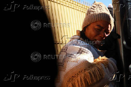 Margelis Tinoco from Colombia reacts after her appointment with CBP was canceled, in Ciudad Juarez