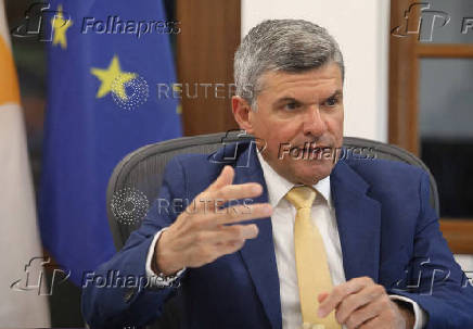 FILE PHOTO: Cyprus' Minister of Energy, Commerce and Industry George Papanastasiou speaks during an interview with Reuters at his office in the ministry in Nicosia