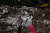 Aftermath of deadly floods and landslides in a village of Trusina