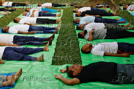 People practice yoga at Ramna Park in the morning, in Dhaka