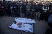 Palestinians mourn their dead following Israeli airstrike on Al-Mawasi