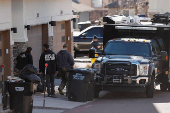 Investigators search a townhouse, in relation to the explosion in Las Vegas of a Tesla Cybertruck