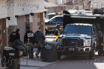 Investigators search a townhouse, in relation to the explosion in Las Vegas of a Tesla Cybertruck