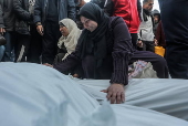 Palestinians mourn their dead at Deir Al Balah hospital after Israeli airstrike in central Gaza