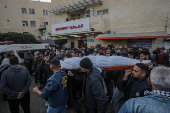 Palestinians mourn their dead at Deir Al Balah hospital after Israeli airstrike in central Gaza