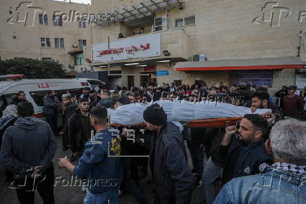 Palestinians mourn their dead at Deir Al Balah hospital after Israeli airstrike in central Gaza