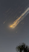 Orange balls of light fly across the sky as debris from a SpaceX rocket launched in Texas is spotted over Turks and Caicos Islands