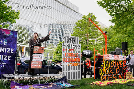 Activists protest outside of the World Bank during the IMF and World Bank's 2024 annual Spring Meetings in Washington