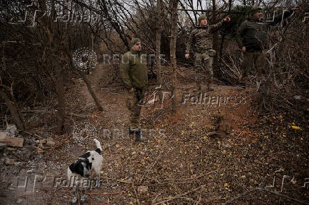 Servicemen are seen at their positions near a frontline near the town of Chasiv Yar