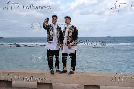 People gather to celebrate Eid wearing traditional Libyan outfits in Benghazi