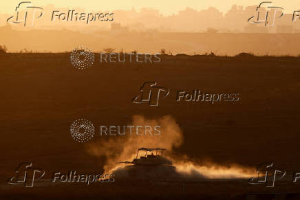 An Israeli tank manoeuvres in Gaza