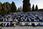 Palestinians pray on the first day of the Muslim holiday of Eid al-Adha, in Jerusalem's Old City