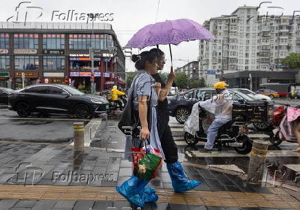 Daily life amid rain in Beijing