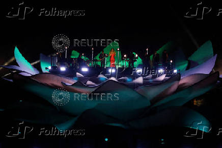Mariah Carey performs on a floating stage shaped like a giant Victoria amazonica water lily at the Guama River in Belem