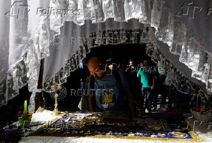 Worshippers gather for the celebrations for the Passion of the Lord at the Church of Saint Clement of Ohrid, on Good Friday, in Skopje