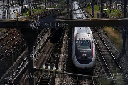 A TGV high speed train leaves a railway station in Paris