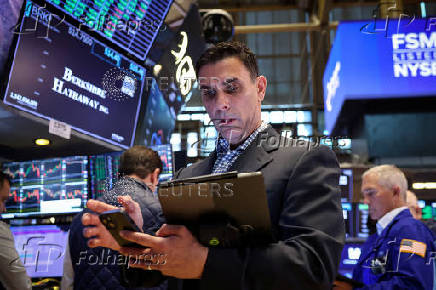 Traders work on the floor of the NYSE in New York
