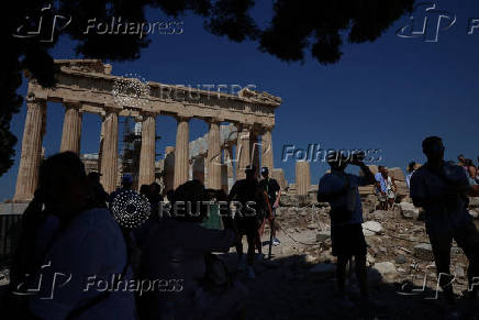 Tourists visit the Acropolis during a 3-days heatwave in Greece