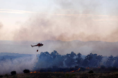 A wildfire burns on the outskirts of Valmojado